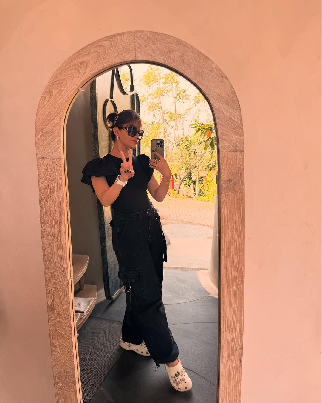 This picture has Rubina Dilaik slaying in an all black outfit as she poses for a mirror selfie
