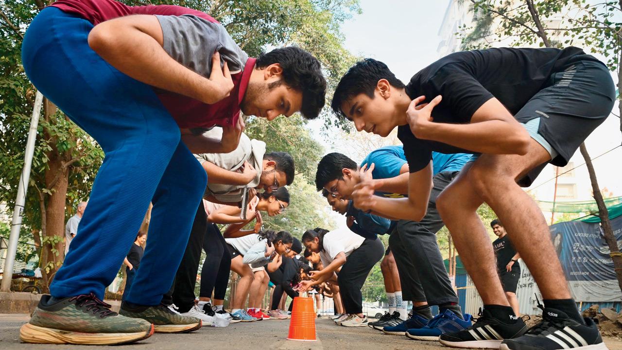 Runners play a game as part of the post-run activity session 