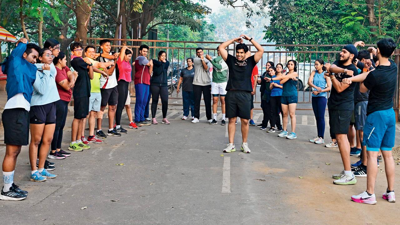 Members participate in warm-ups and cool-downs before and after the early morning runs