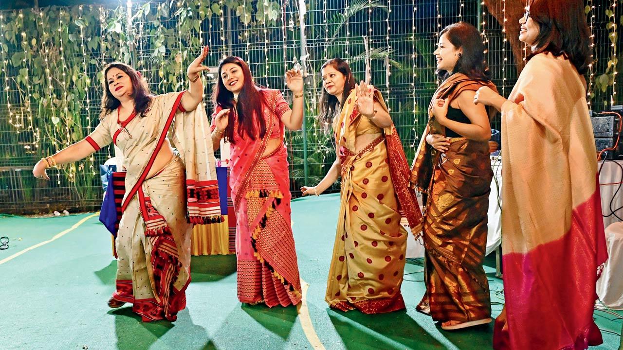 Women gather for a group dance at the celebration 