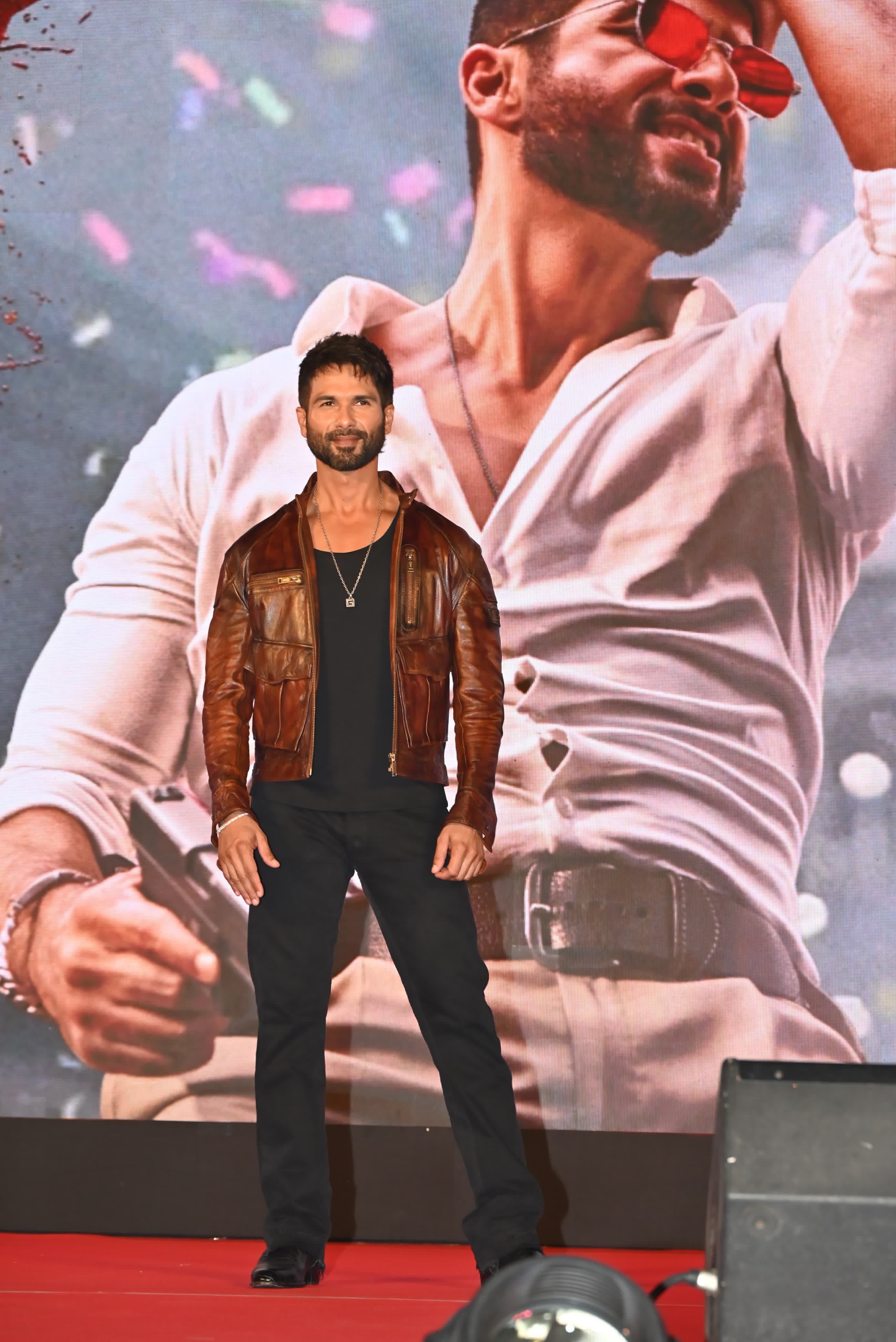 Shahid Kapoor was snapped at the Devara teaser launch. The actor was clicked in a black outfit paired with a brown jacket