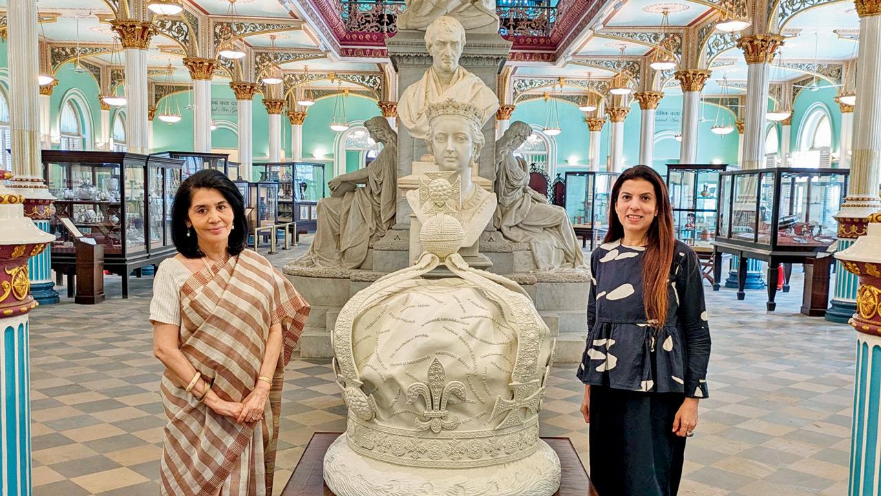 Tasneem Zakaria Mehta (left) and Reena Saini Kallat alongside the latter’s installation, Memoria Corona, at the museum