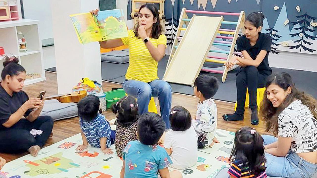 An educator engages children in an interactive reading session