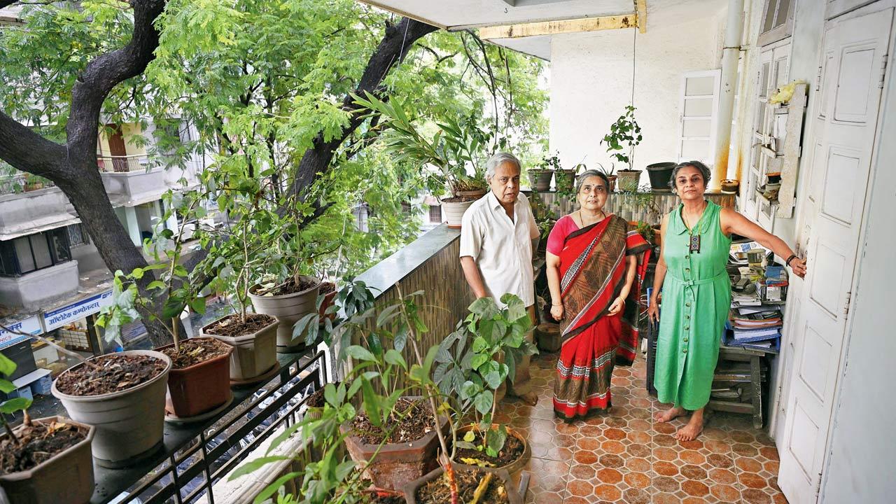 Jayamala Joshi (right) with neighbours Jayesh Sohoni and his sister Shubha, on the only open balcony left in the Model House colony. File pic