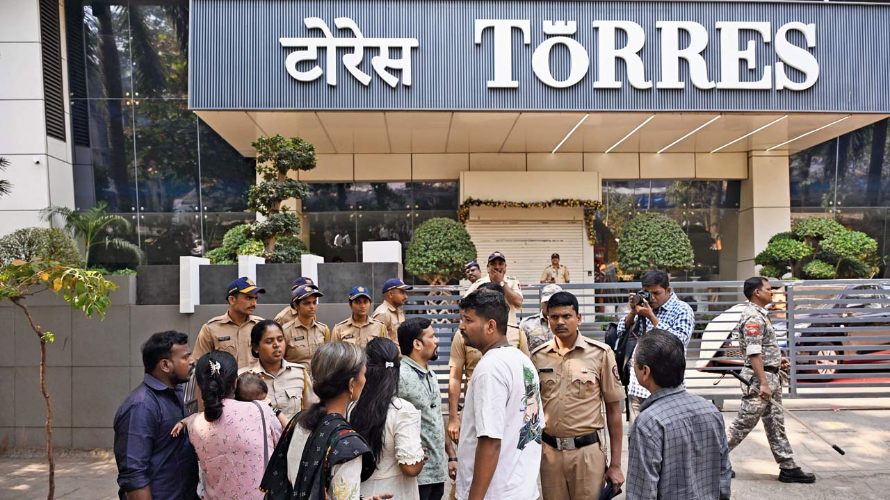 Investors gathered outside the Torres Jewellery store in Dadar