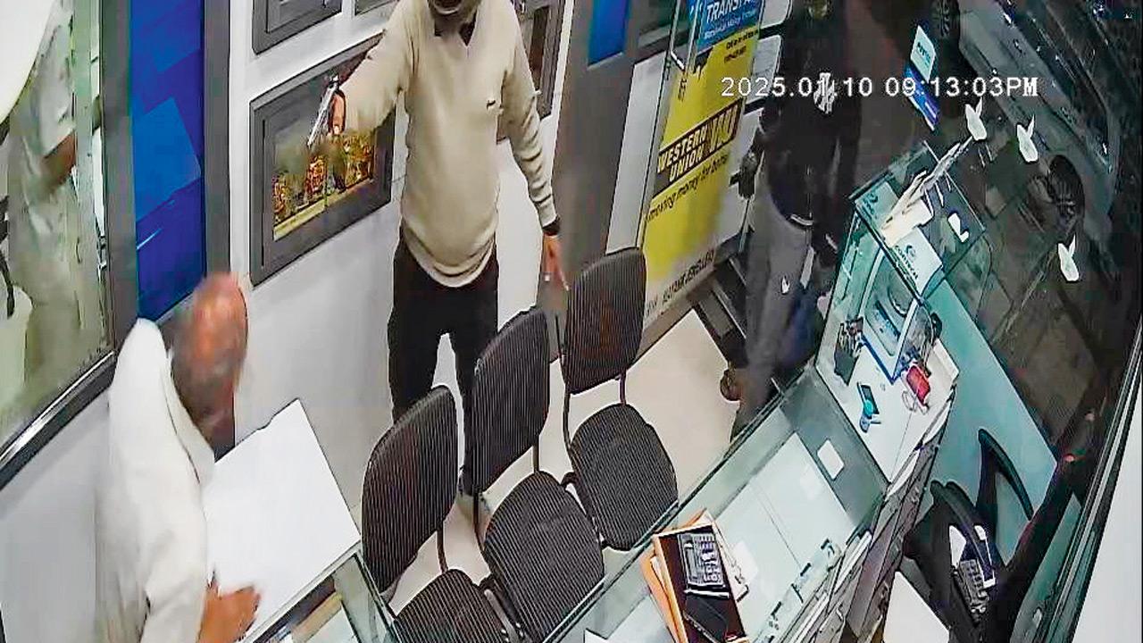 CCTV footage of the store owner being threatened with a gun