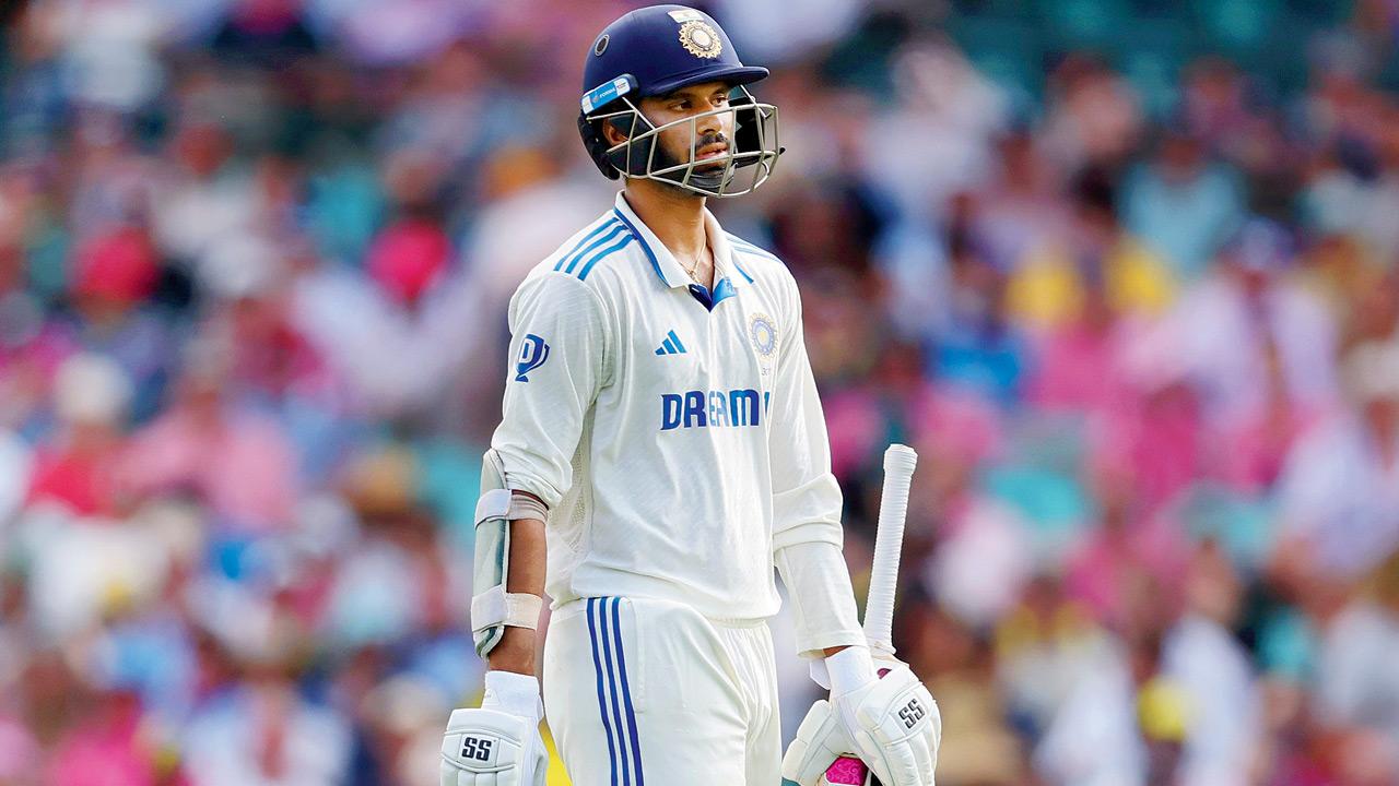 A dejected Washington Sundar walks back after being dismissed by Pat Cummins in Sydney