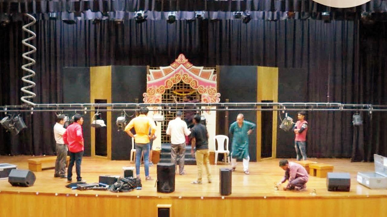 The crew readies the stage before a production
