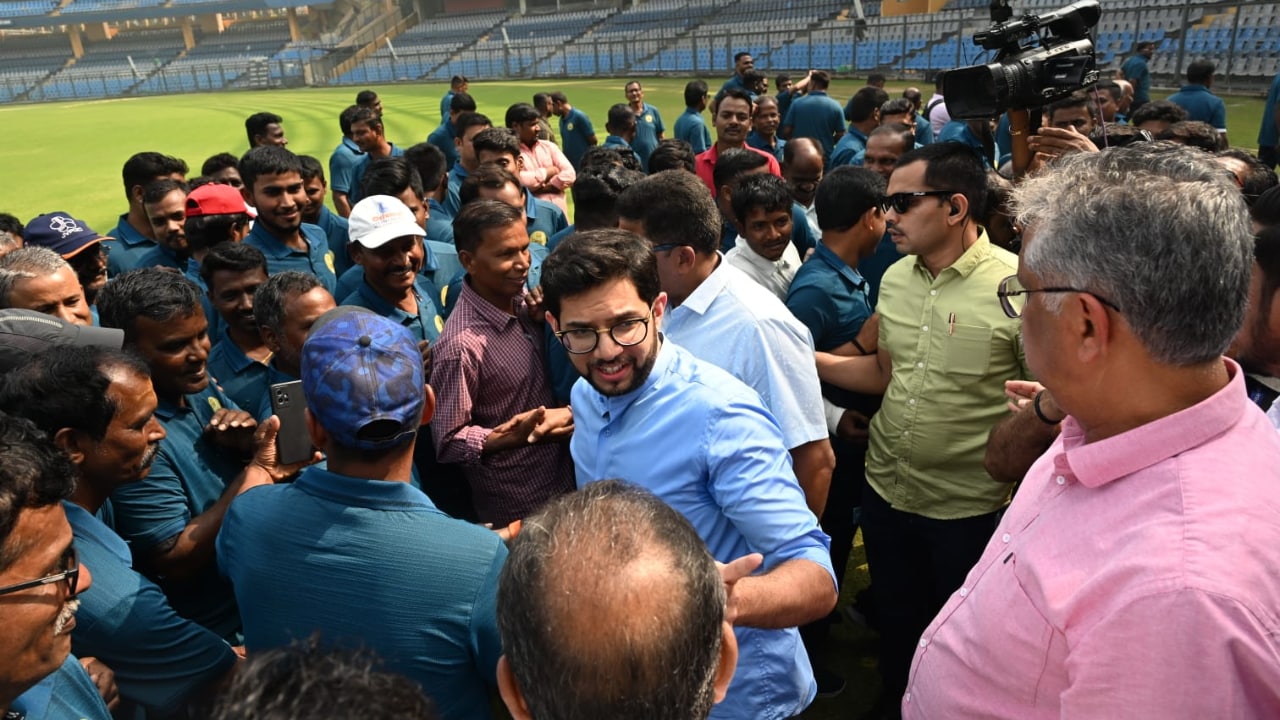 Wankhede Stadium's groundsmen gather around Aditya Thackeray to click pictures