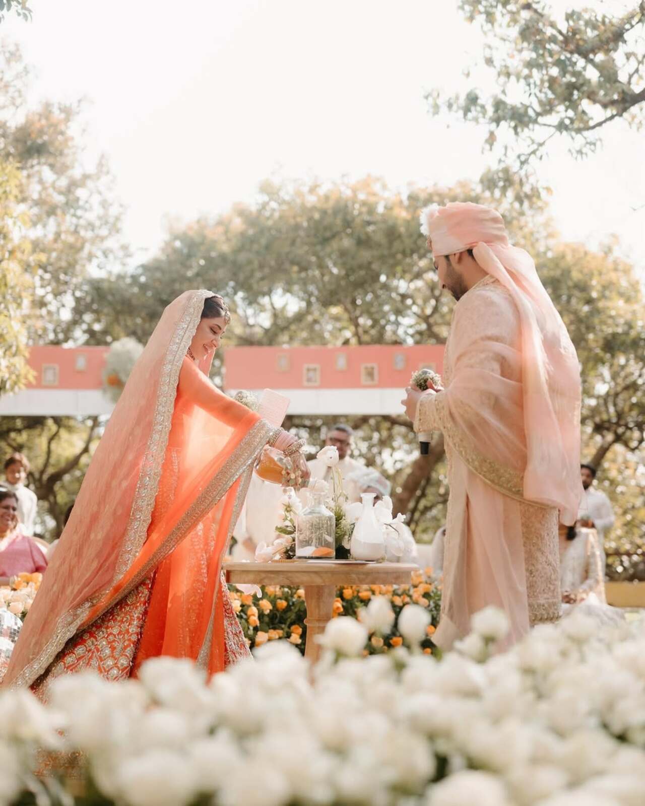 For their special day, Aashna opted for a radiant orange-coloured lehenga designed by Manish Malhotra. She complemented her bridal look with exquisite jewellery from the same designer