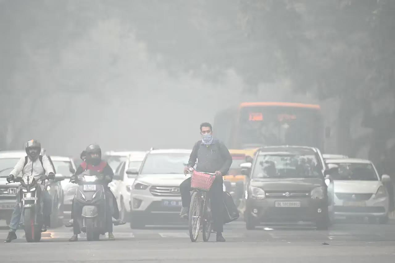 Dense fog and poor air quality impact traffic and trains in Delhi