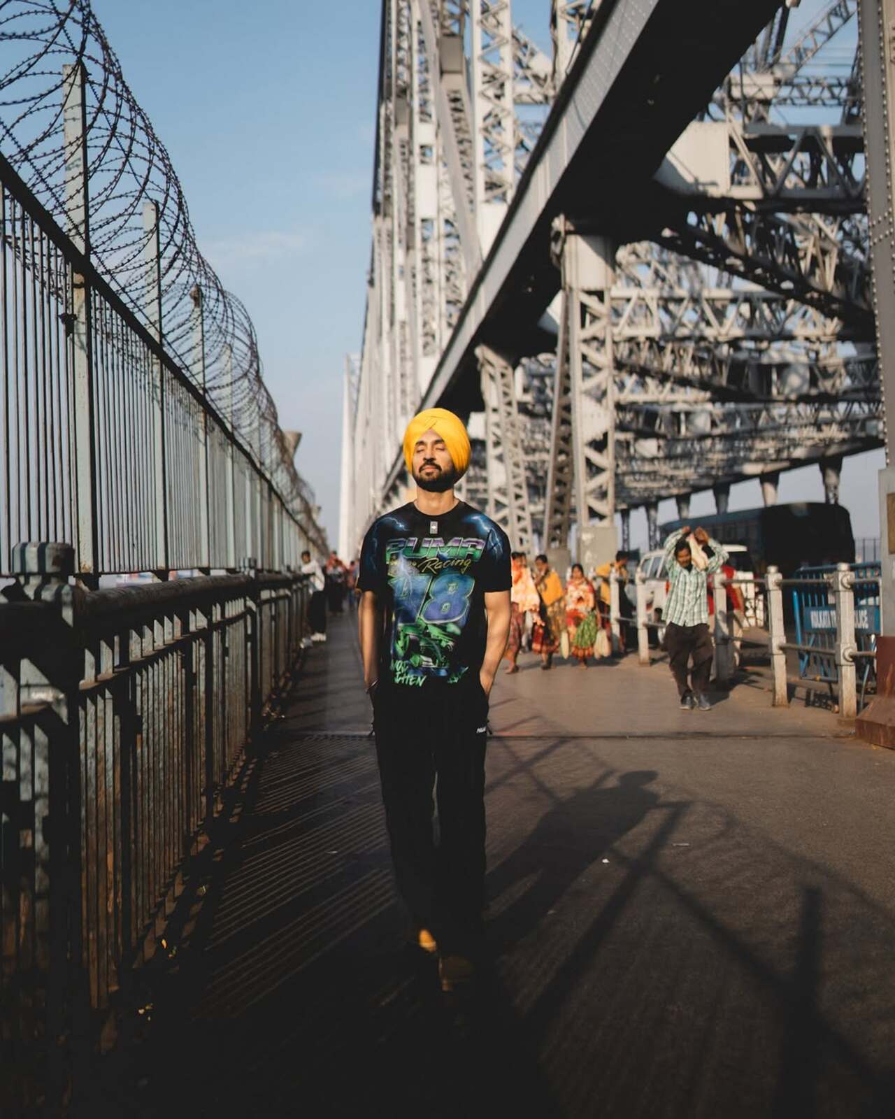 The singer poses on the famed Howrah Bridge in Kolkata