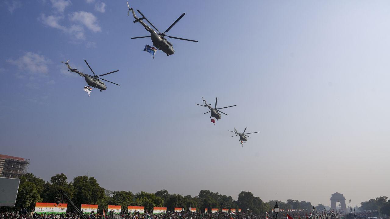 Tri-Services helicopters fly past during the full dress rehearsal for the Republic Day Parade 2025 at the Kartavya Path