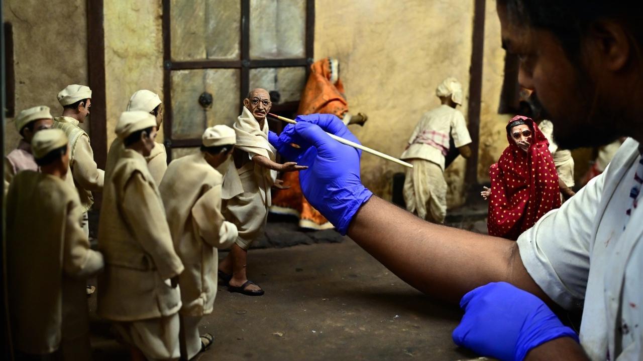 IN PHOTOS: Artist adds final touches to Mahatma Gandhi's miniature statue