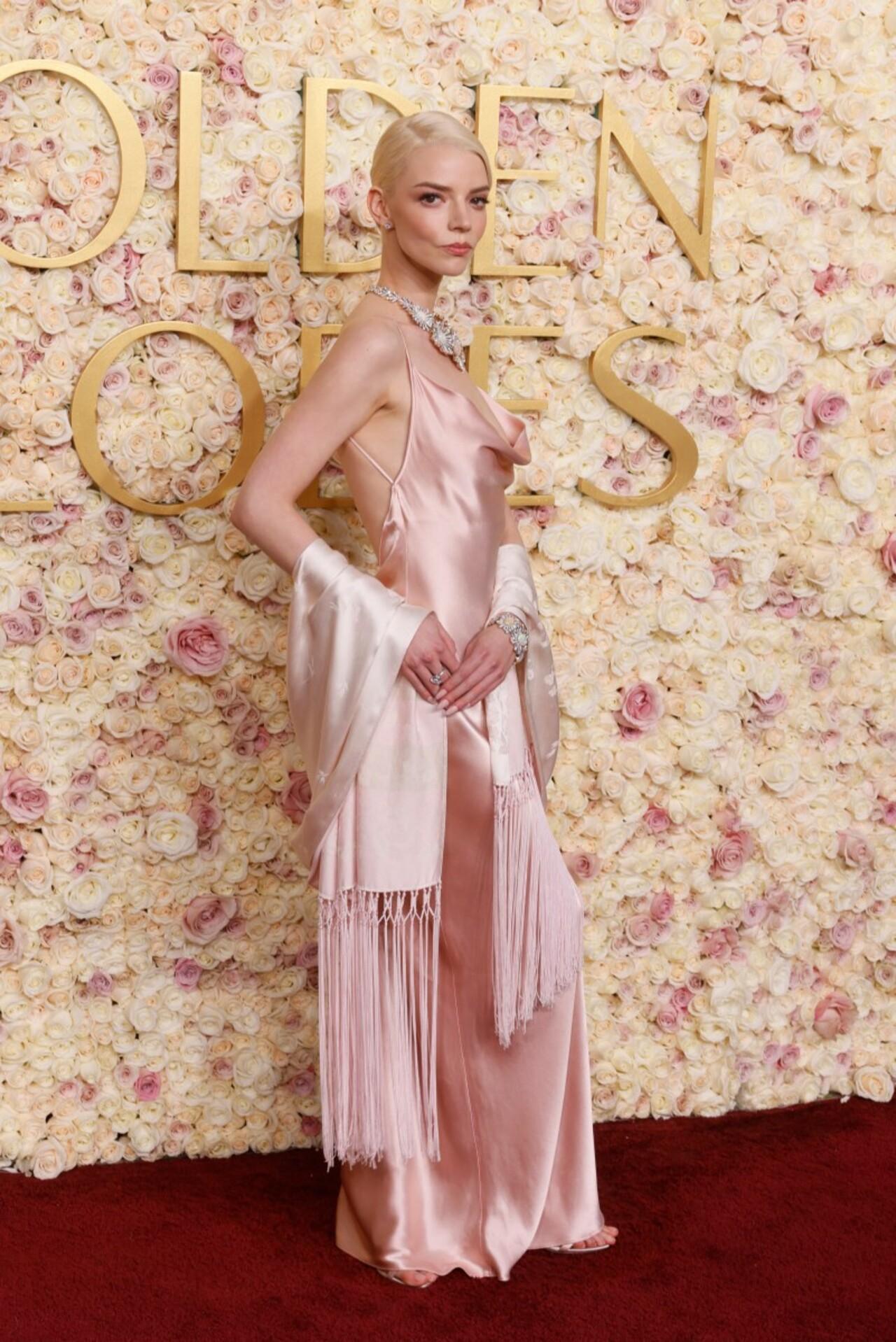 Anya Taylor-Joy looked like a million bucks in a bubblegum pink satin ensemble.