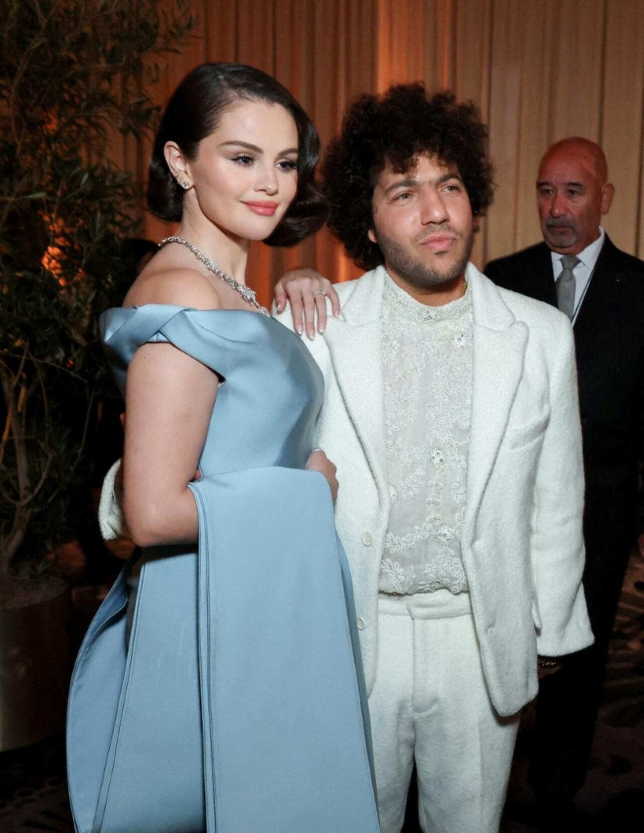 Selena Gomez stole everyone's attention when she stepped out on the red carpet in a Prada ensemble. She looked like a Cinderella in her old Hollywood-inspired look. Her gown featured a structured bodice and a multi-layer pleated skirt with a train that she draped over her arm. She was accompanied by her fiance Benny Blanco.