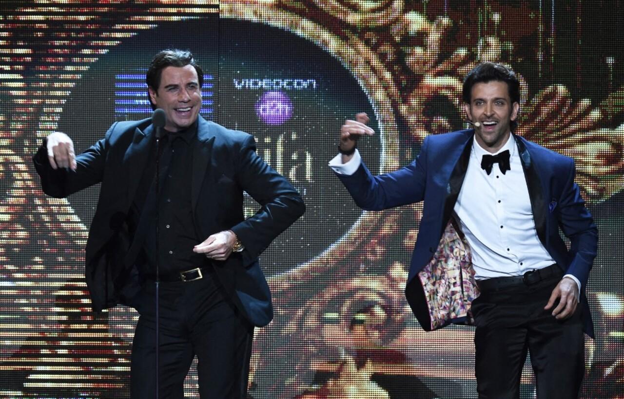 Hrithik dancing with Hollywood actor John Travolta at the 15th International Indian Film Academy (IIFA) Awards at the Raymond James Stadium in Tampa, Florida.
