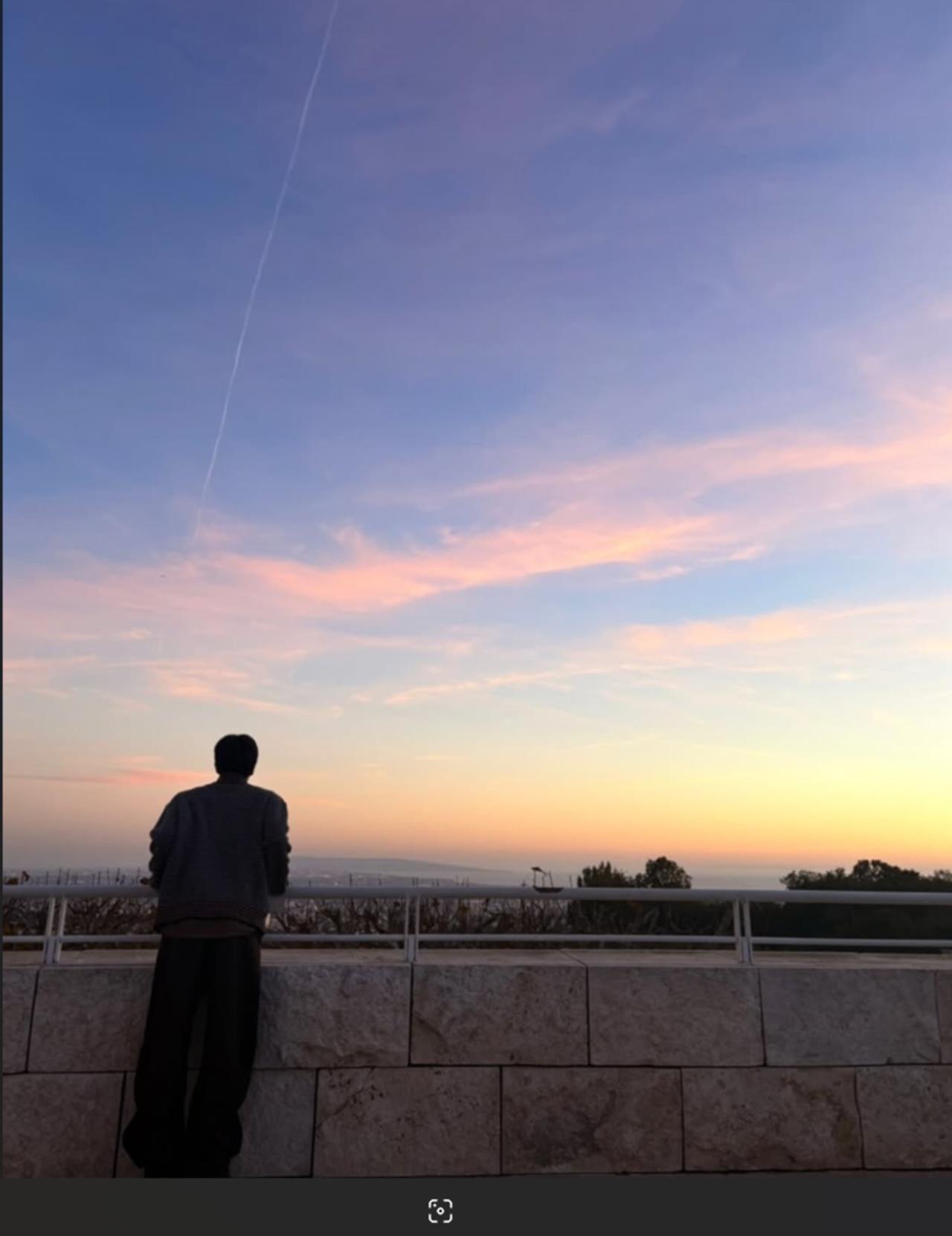 J-hope shared this picture of himself where he is seen enjoying the beautiful sunset. 