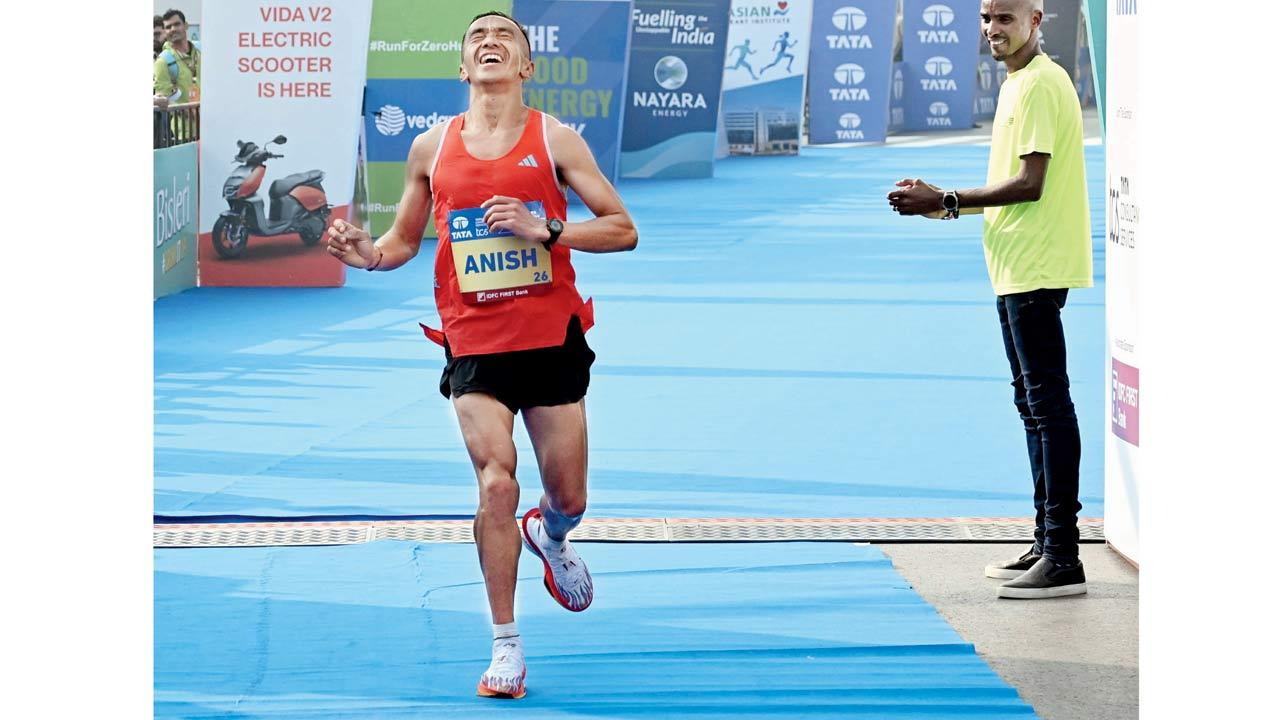 India’s Anish Thapa  crosses the finish line 
