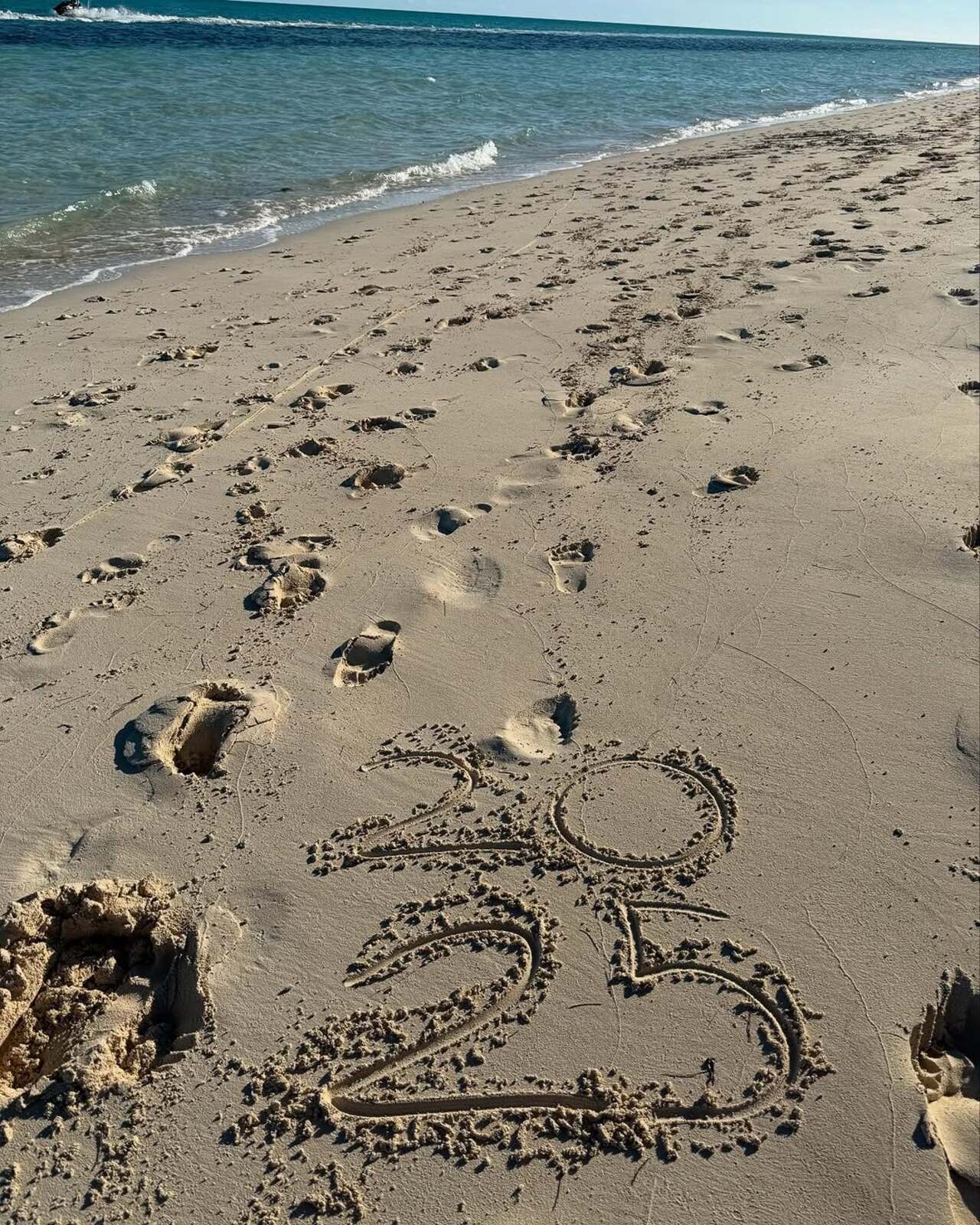 The actress also shared a picture of 2025 written on sand probably by her