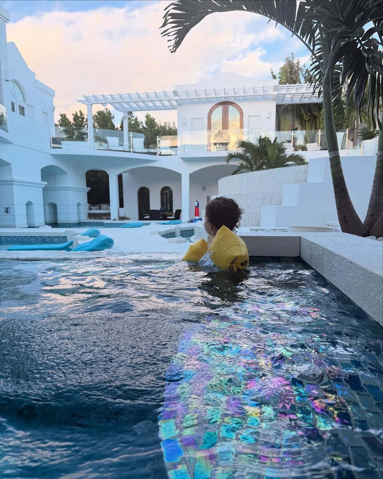Malti learns to swim with a floater around her body