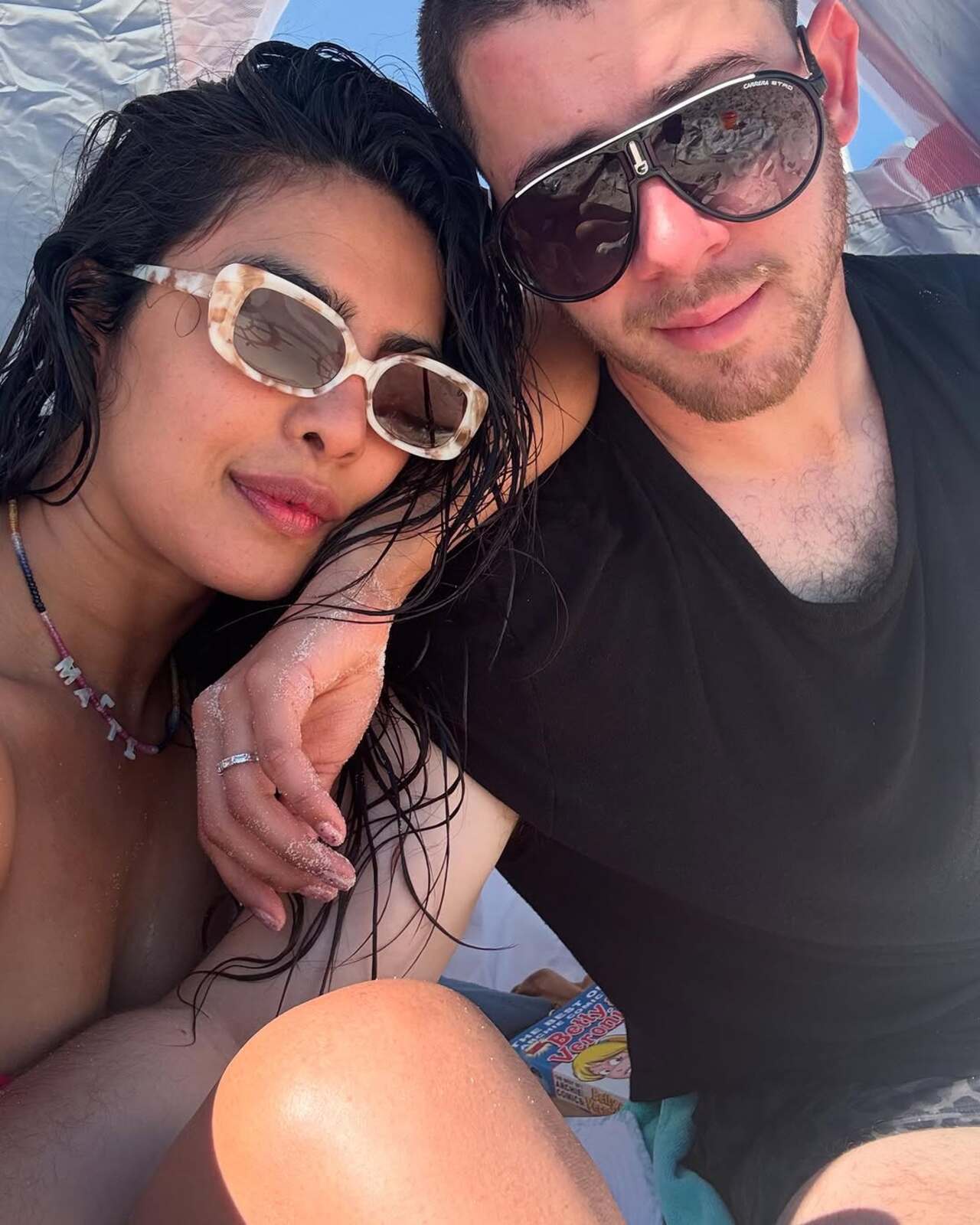 The pictures clicked on the beach and at a beach house villa reflects on the fun the couple had with their kid 