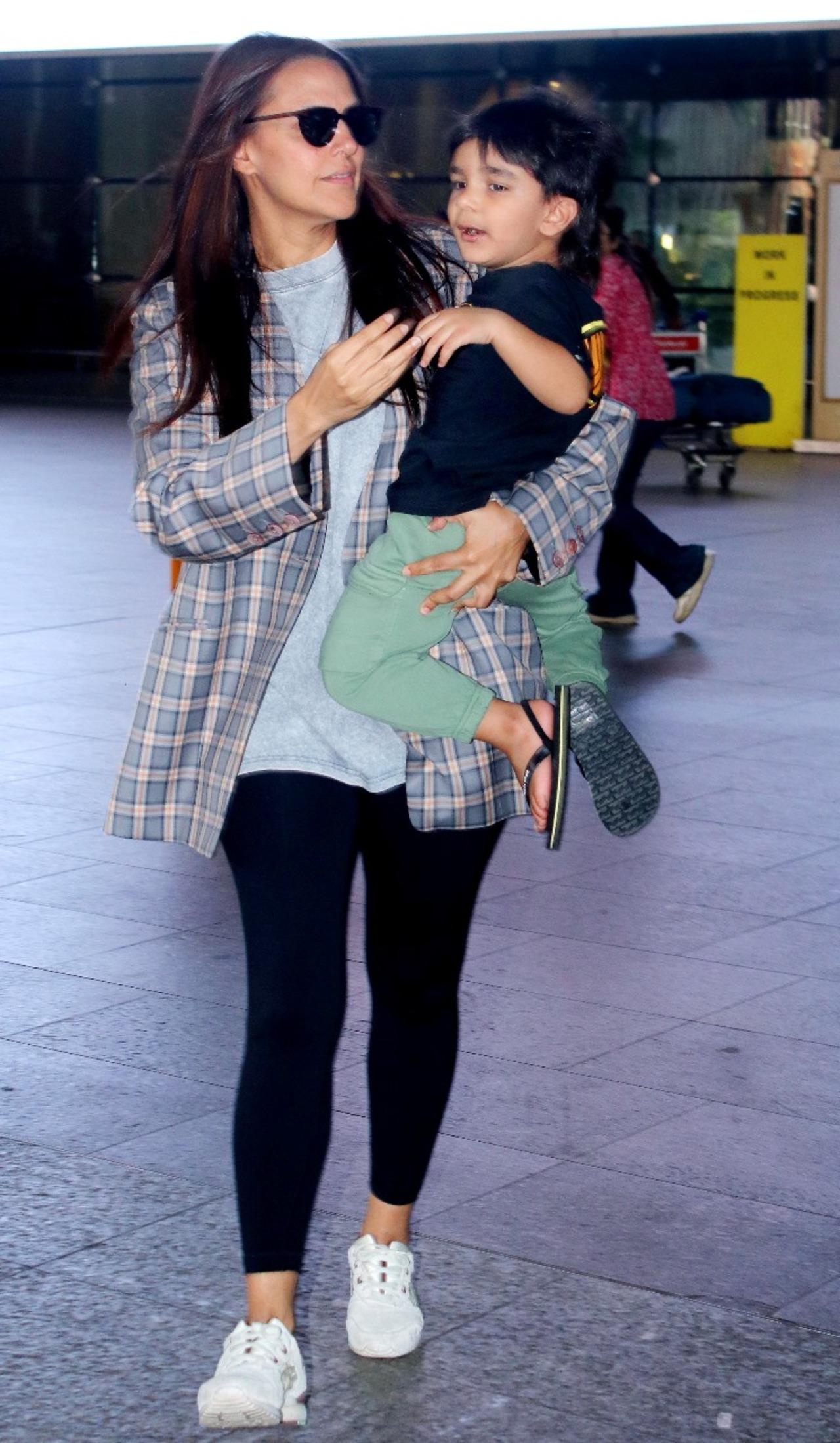 Neha Dhupia spotted at the airport with her son