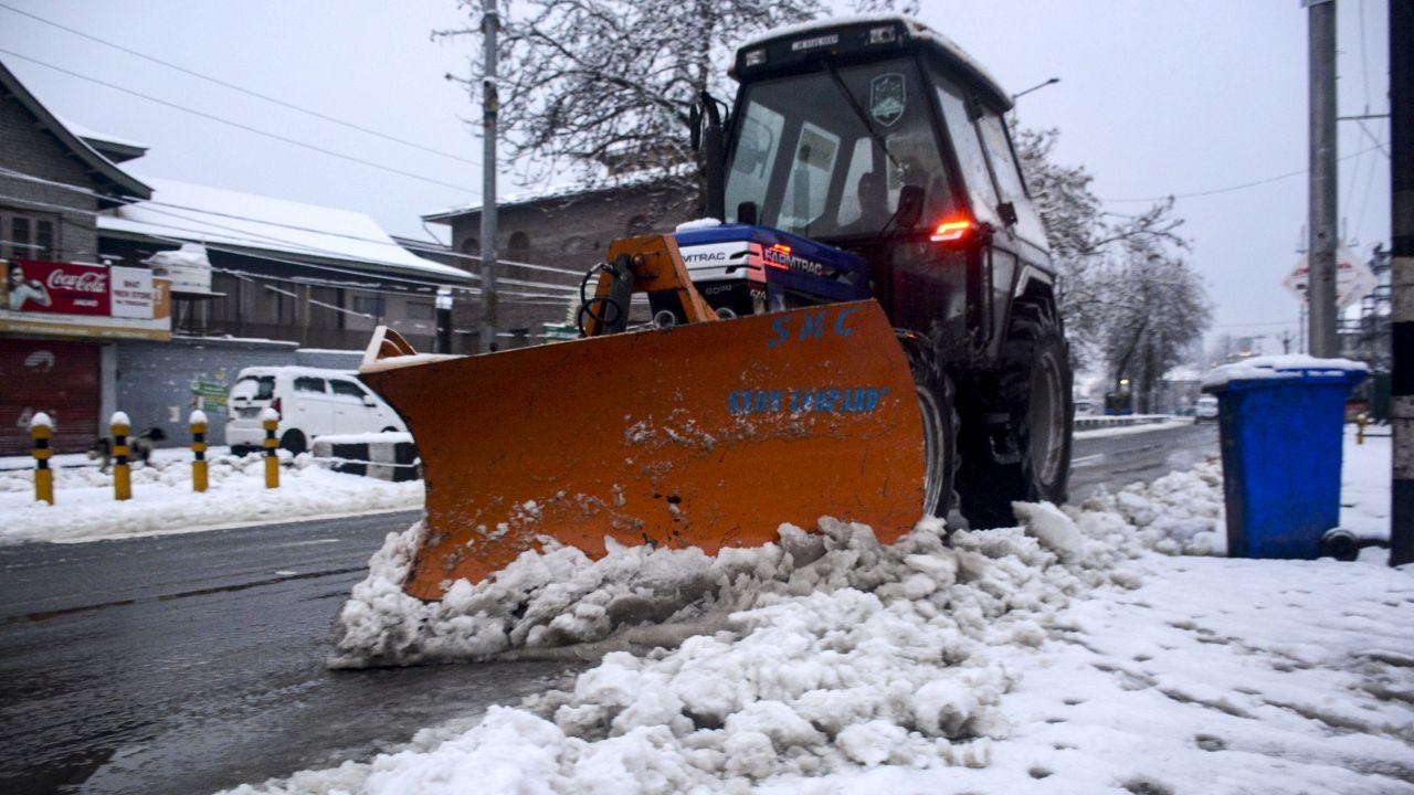 J&K CM Omar Abdullah on Monday said post-snowfall restoration work in the valley was underway in full swing and being closely monitored. (In Pic:  A machine is being used to clear snow from a road after fresh snowfall)