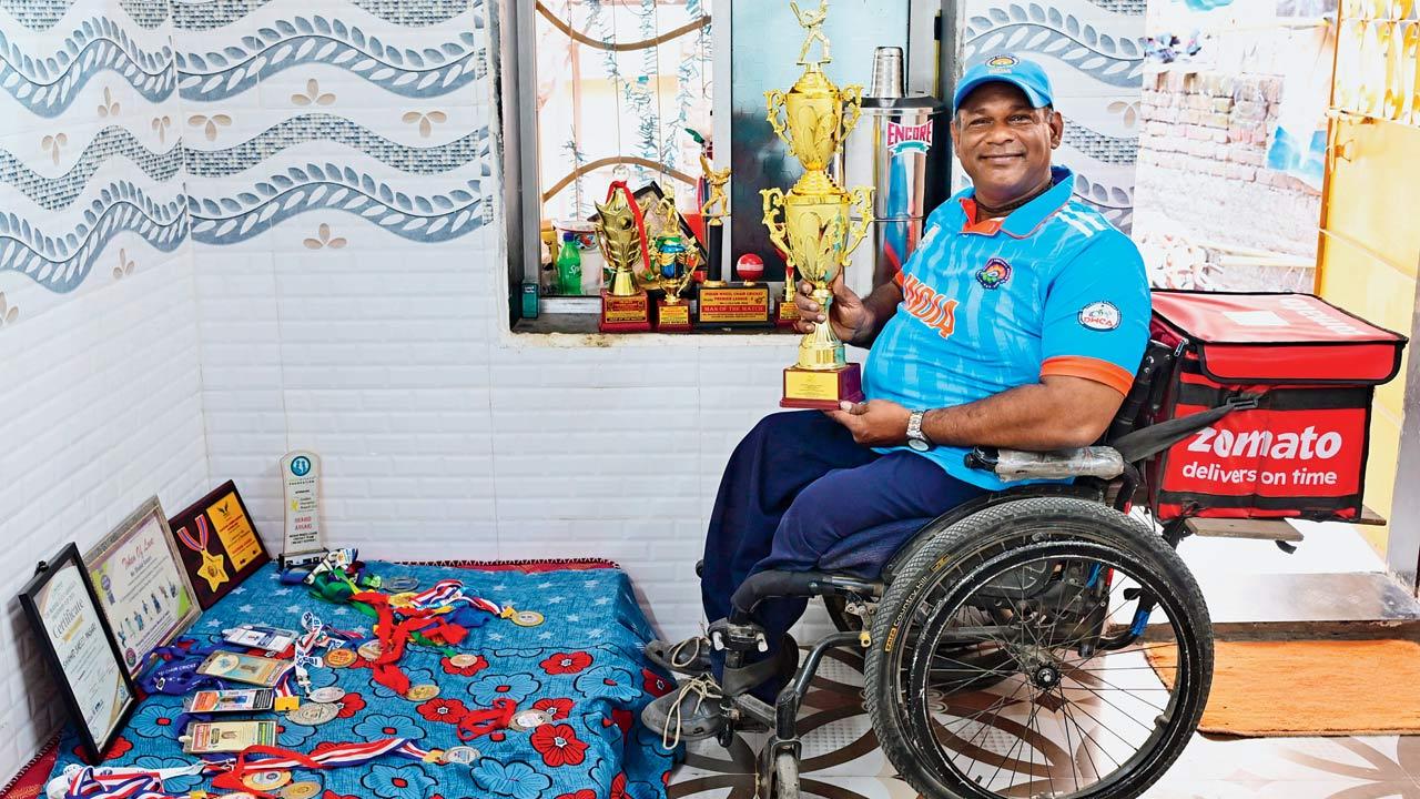 Ansari with his collection of trophies and medals at his modest home in Malwani 