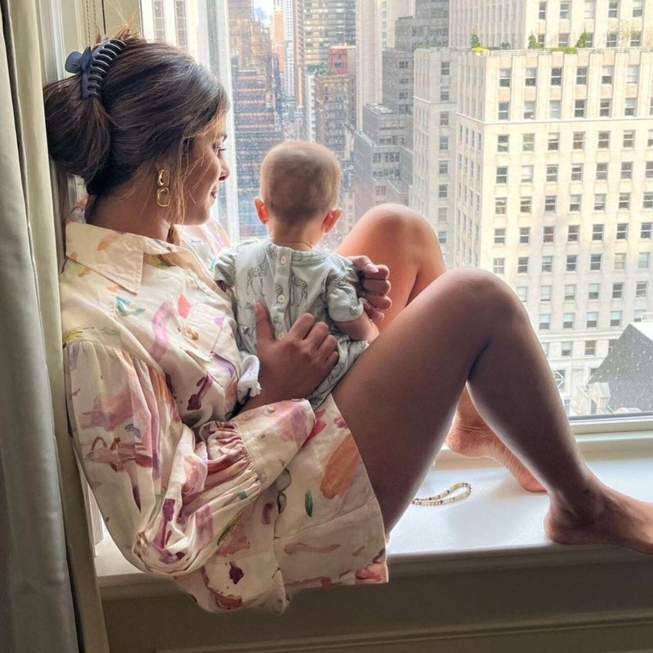 Eyes on you! Despite having one of the most beautiful city view right in front of her, PeeCee has her eyes fixated on her little one, who enjoys the view instead.