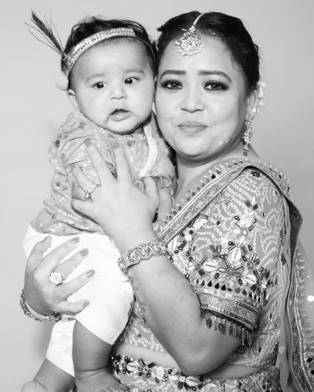 Bharti with her little Lord Krishna is too cute to handle. The way she holds him close as he securely holds on is just adorable.
