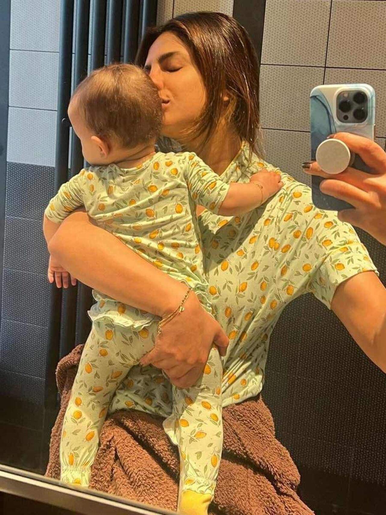 Setting major mother-daughter goals, Priyanka and little Malti Marie twin in matching night suits as they click the perfect mirror selfie.