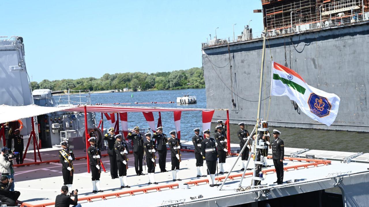 The Indian Tricolour and Naval Ensign hoisted with full honours as INS Tamal is formally commissioned into the Indian Navy fleet.