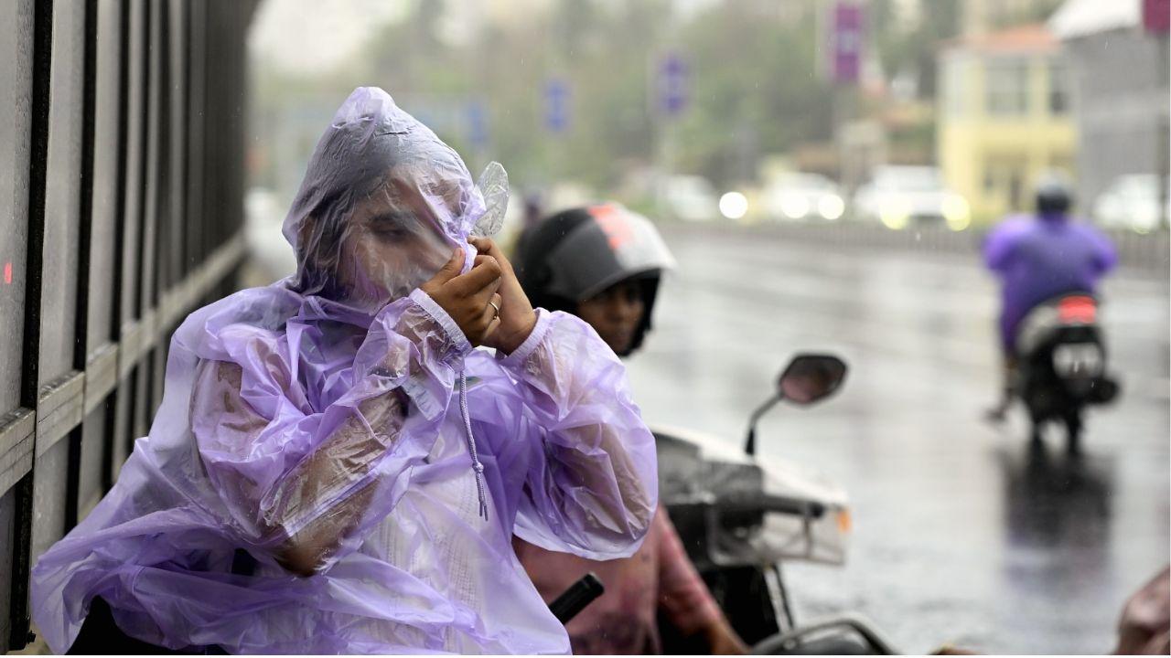 Gusty winds and intense showers in South Mumbai prompted residents to wear raincoats and take extra precautions.