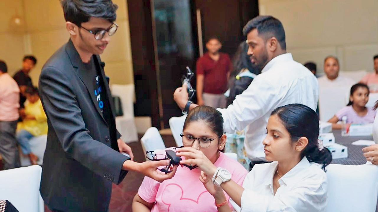 Apurva Donde (in black) supervises the assembly of a drone. Pics Courtesy/Drona Aviation
