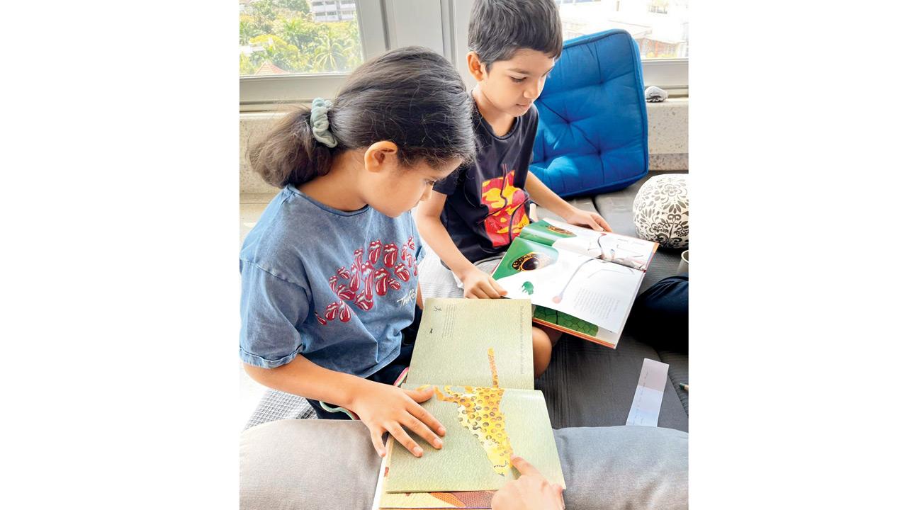 Children read illustrated books at a  previous workshop.  PIC COURTESY/Bhavna Faizullabhoy
