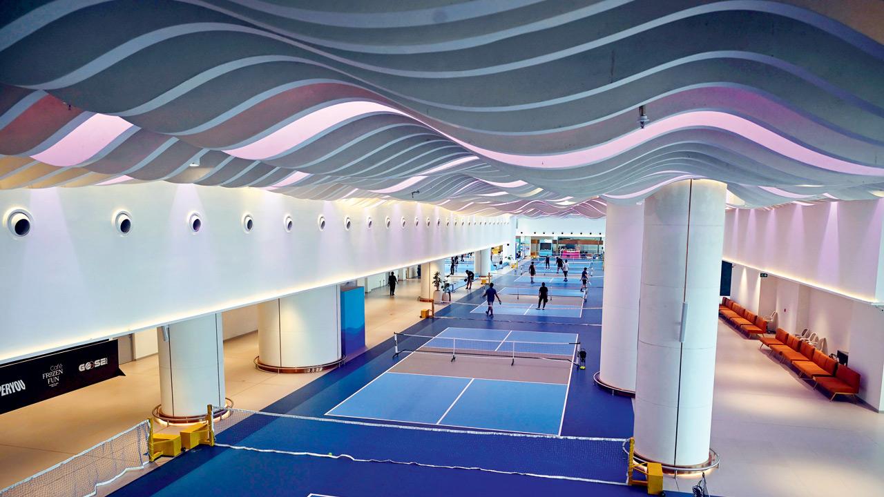 The spacious hall hosts eight rollable pickleball courts
