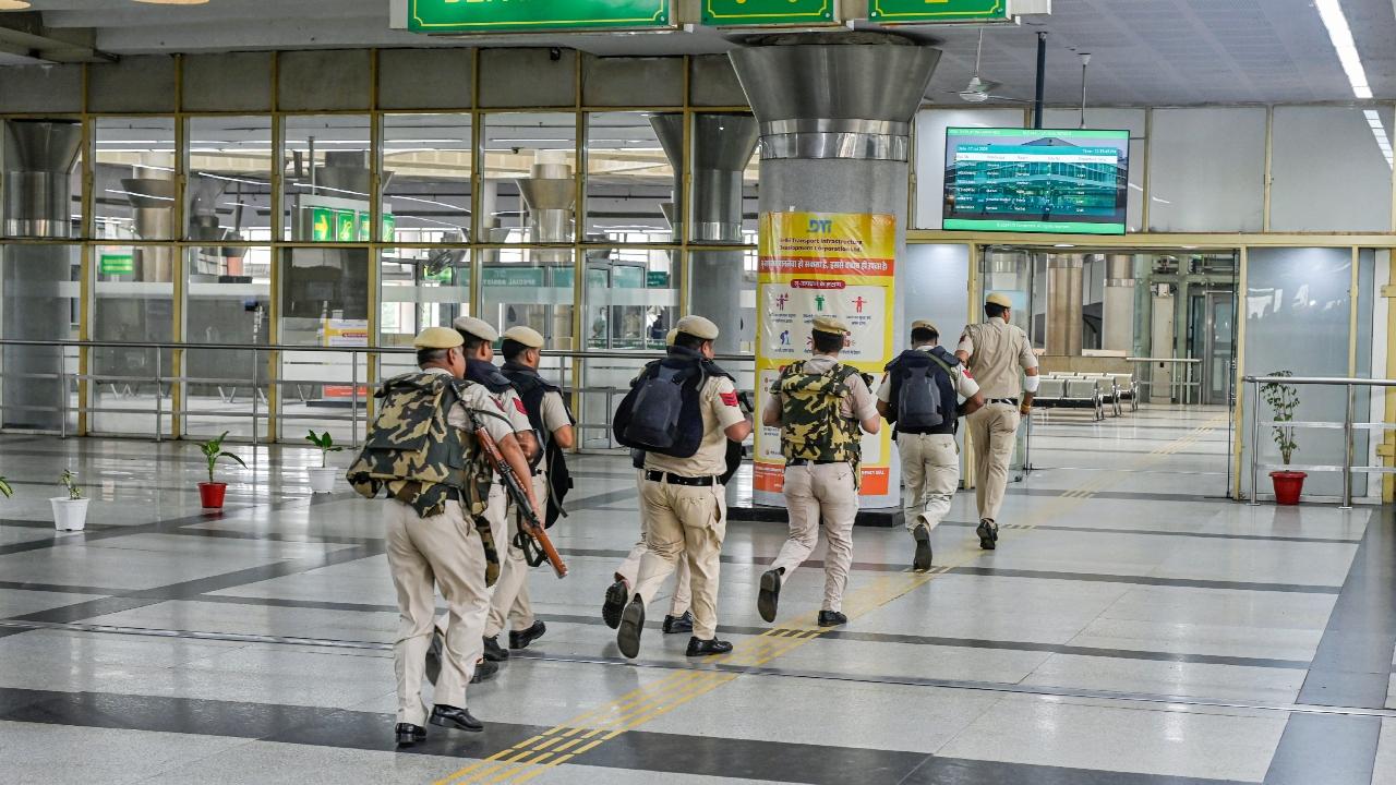Responding swiftly, Delhi Police personnel cordoned off the area, while loudspeaker announcements instructed commuters and staff to vacate the terminal. Police vans and Quick Reaction Teams were rushed to the scene