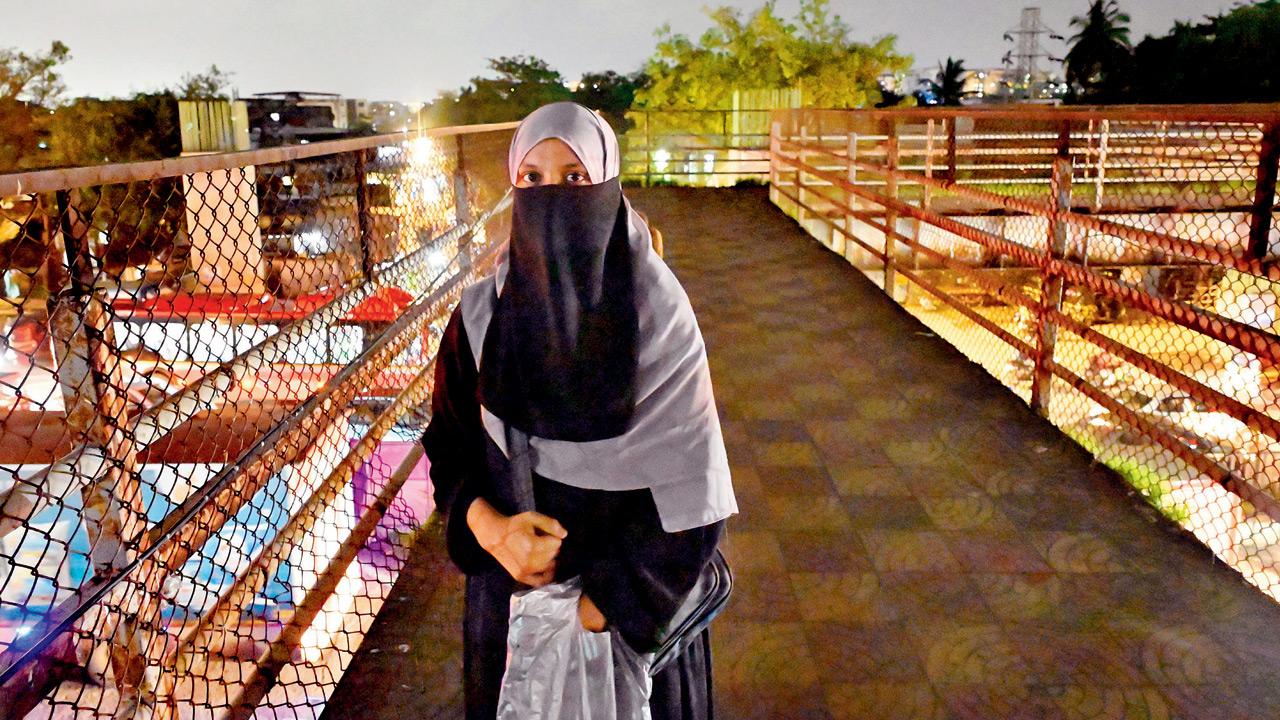 Zeenat Shaikh on the Kurla foot overbridge, located on the Santacruz-Chembur Link Road, which is linked to the Eastern Express Highway, on the night of July 8