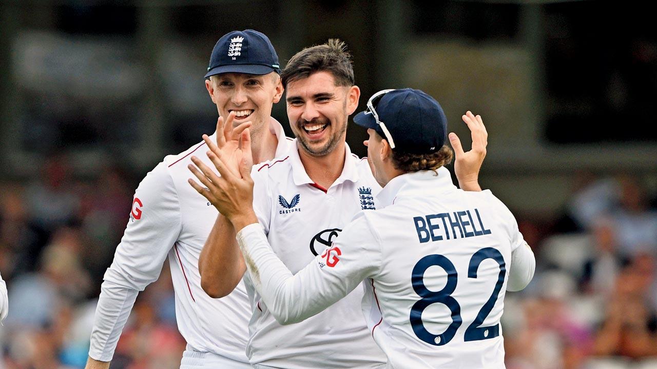England players celebrate the wicket of Ravindra Jadeja on Thursday. Pic/Bipin Patel