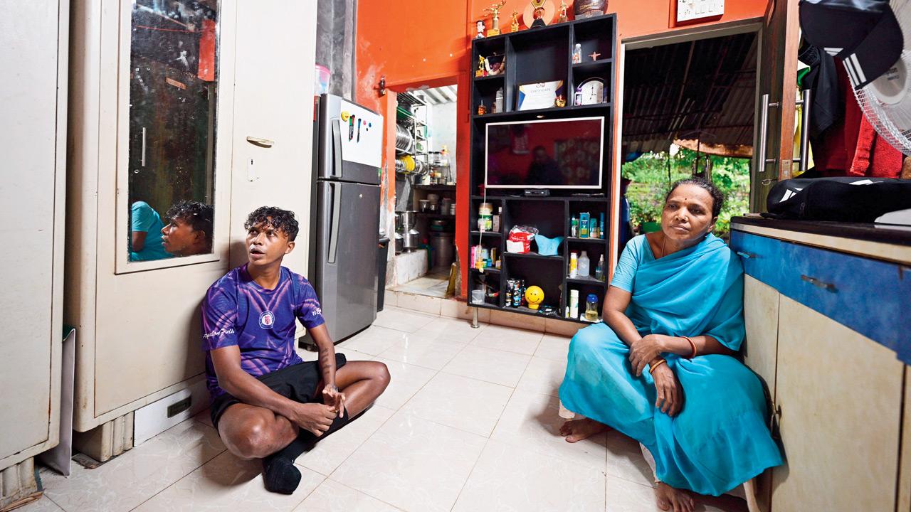 Mumbai Knights football club owner Preetam Mahadik with his mother Suman at their modest home in Pali, Bandra