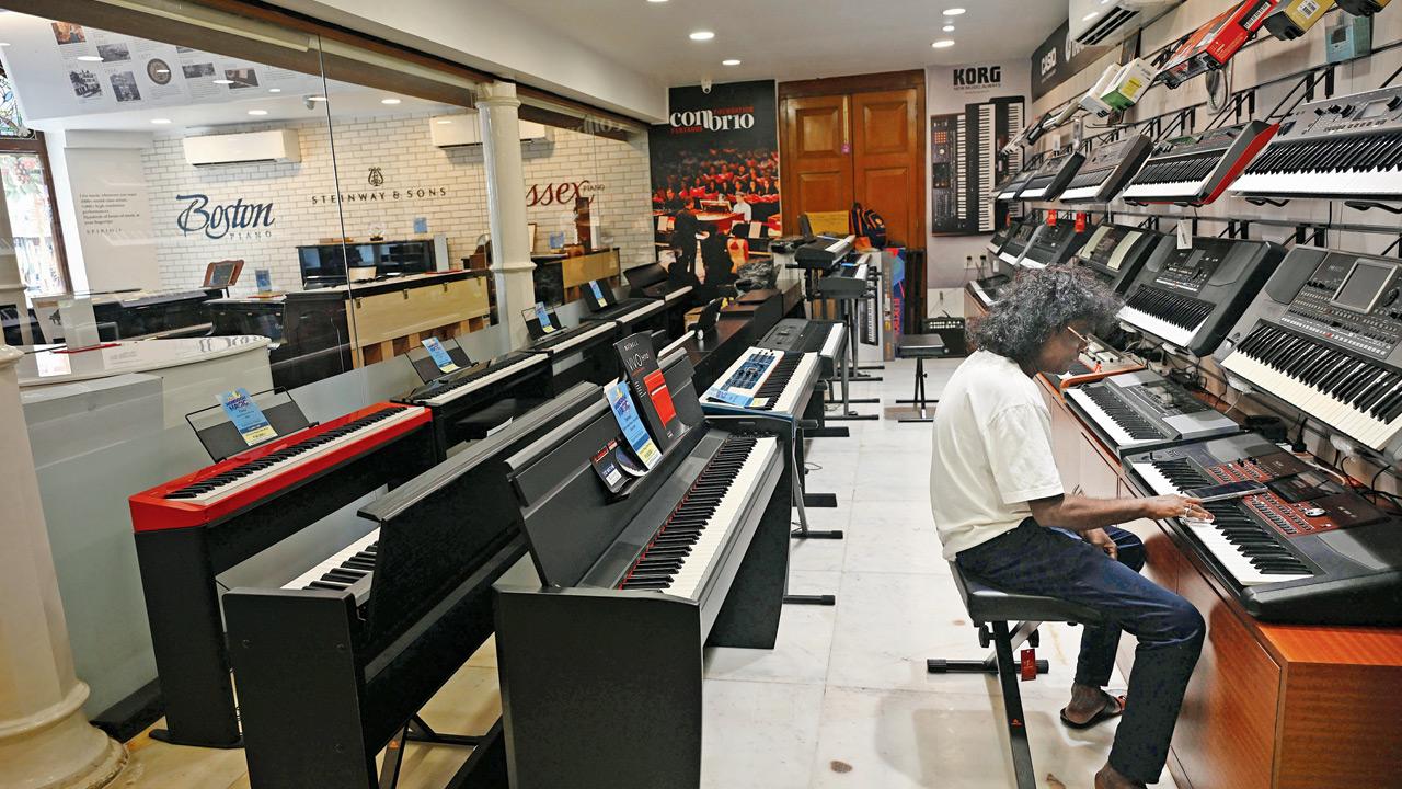 A visitor tries a keyboard at the store. Pics/Kirti Surve Parade