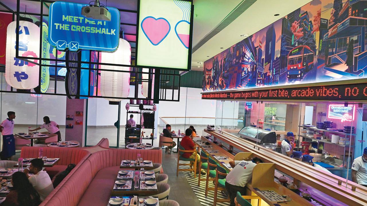 A diner sits by the sushi conveyor belt. PICS/SATEJ SHINDE