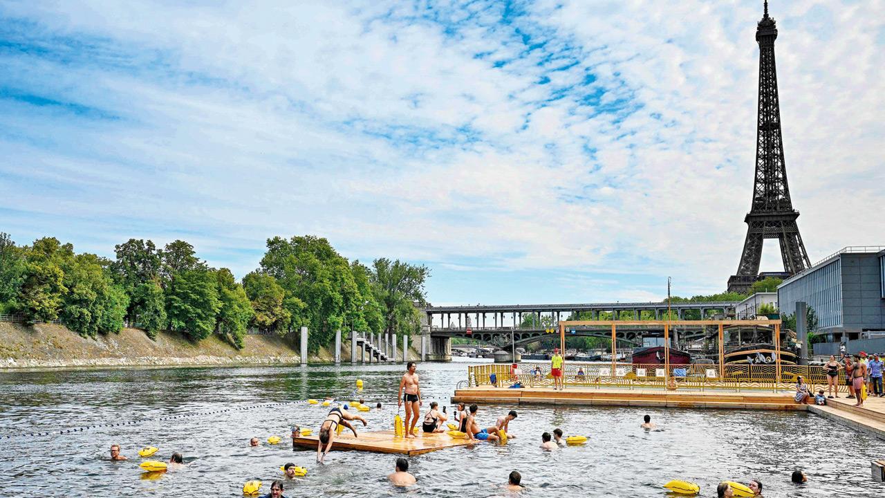 Parisians take a Seine-ic dive