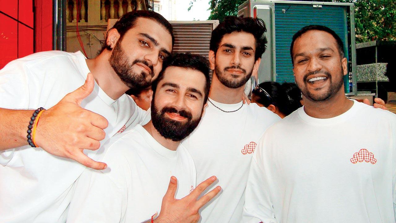 From left to right:  Veer Pinto, Rahul Vohra, and Amay Thakkar (seen here with a friend) are the co-founders of the Croffle Guys 