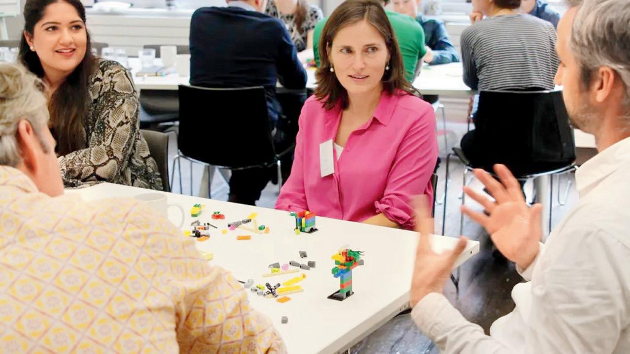 Participants engage in a discussion at a previous session