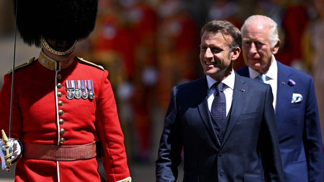 The president and his wife, Brigitte Macron, were greeted on a red carpet laid over the tarmac at London's RAF Northolt air base by Prince William and his wife Catherine, who was wearing a dress by French design house Christian Dior