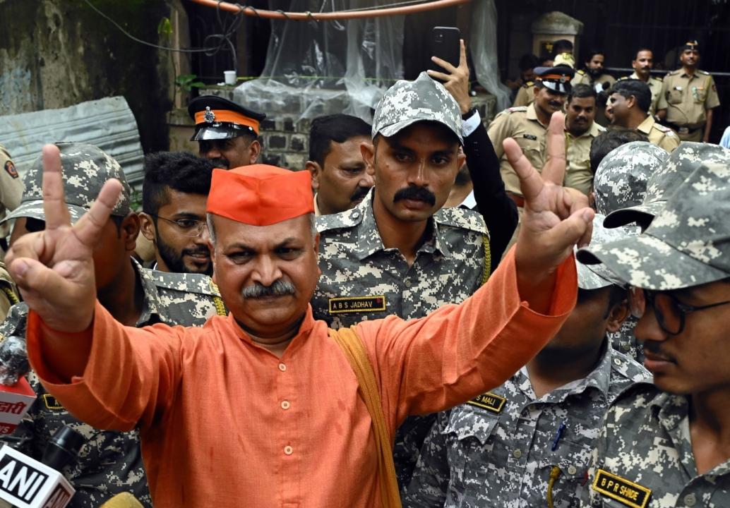Sameer Kulkarni, one of the accused, puts up a victory sign outside the court. On September 29 2008, six people were killed and 95 others injured when an explosive device strapped to a motorcycle detonated near a mosque in Malegaon City's Bhikku Chowk 