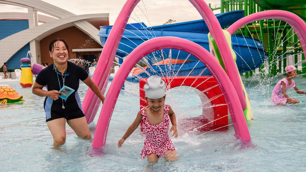 Inaugurated by Kim Jong Un in late June, the tourists play amongst water features in a swimming pool at the Myongsasimni Water Park in the Wonsan Kalma Coastal Tourist Area earlier this week