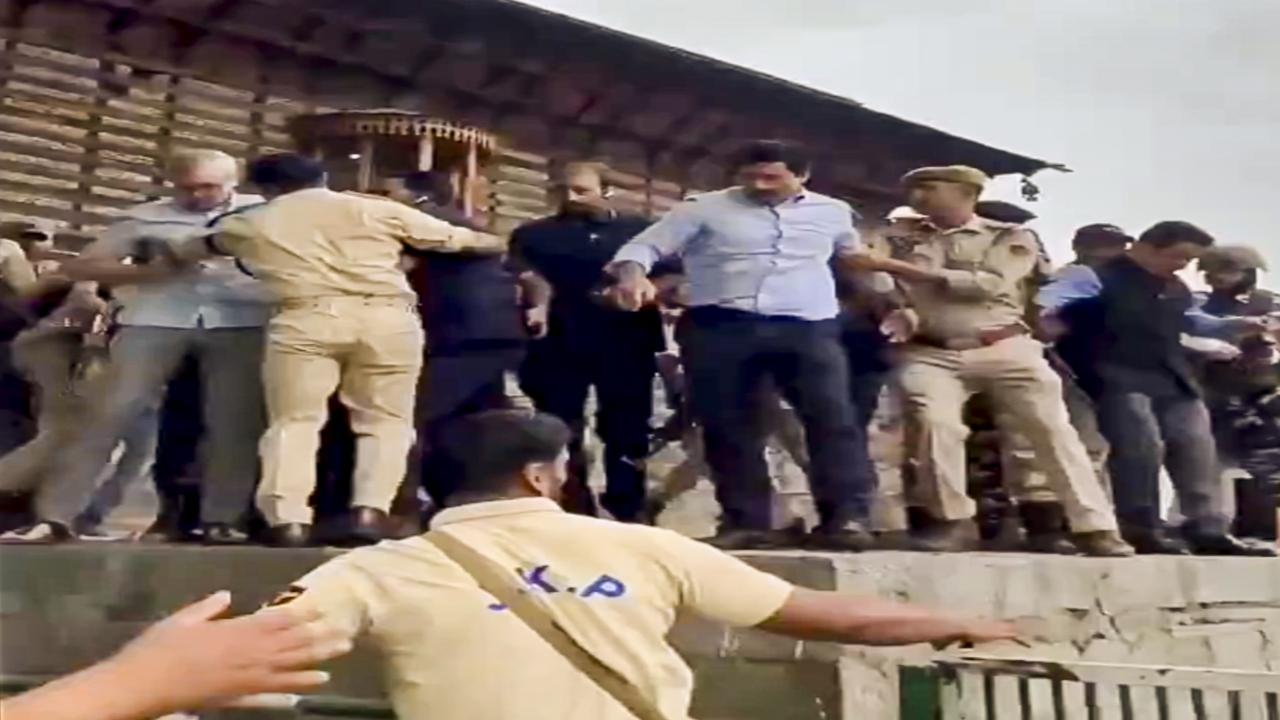 The dramatic scene unfolded a day after Abdullah and several leaders of the National Conference and opposition parties were allegedly put under house arrest to prevent them from going to the graveyard to mark Martyrs' Day on July 13